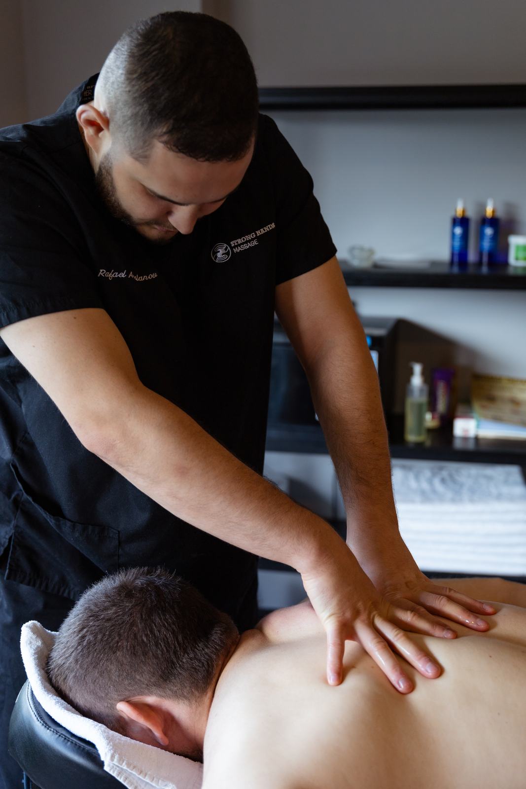 Rafael giving a remedial back massage in the Albion studio
